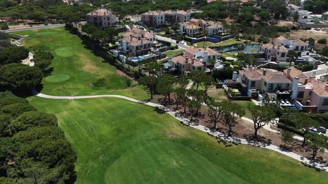 Golfers on the golf course, aerial view.