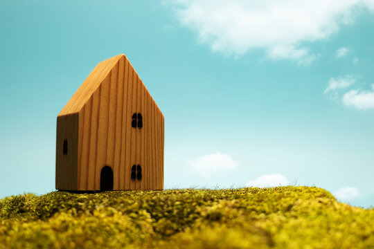 Small wooden house under blue sky,Harmony Lifestyle, sustainable living and green environment