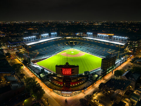 Wrigley field night view from above showing the brightly illuminated baseball diamond in Chicago, Illinois, USA.  September 22, 2023. 