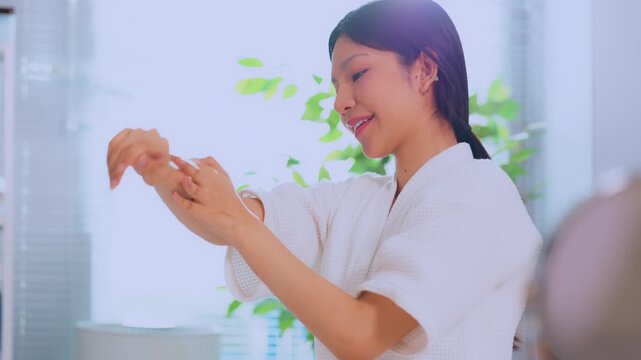 Asian woman hand smile gesture clinic uniform care therapy wellness patient holding milk glass and skincare lotion in bright home spa room for healthy morning routine