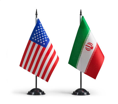 United States and Iran desk flags diplomacy negotiations conflict talks relations.