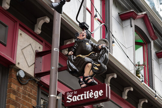 Quebec City, Qu&eacute;bec, Canada, June 27, 2026 -  The quirky Bar Le Sacril&egrave;ge sign at its 447 Saint-Jean street location 