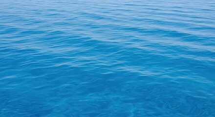 Obraz premium Abstract texture background of clear deep blue saltwater, showing subtle ripples and smooth movement under bright natural daylight in a vast ocean body, aqua, transparent, movement