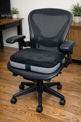 Fototapeta premium A simple office chair with a black frame and a comfortable seat cushion