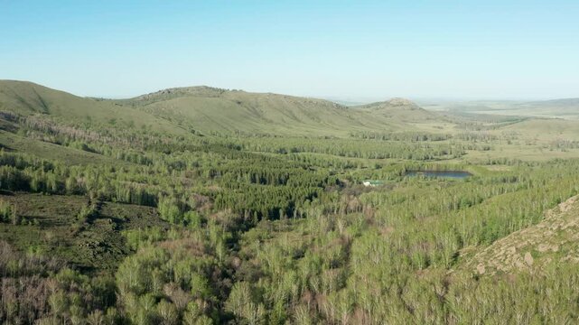 Southern Urals in spring: the Irendyk ridge and the Khudolaz River. Aerial view.