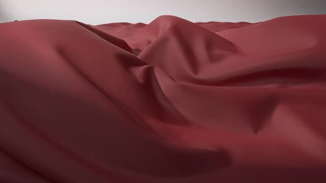 Graceful red fabric flowing in elegant waves and smooth folds creating a luxurious background