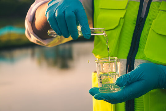 Field inspector water sampling to evaluate purity and detect chemical contamination.