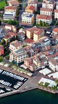 Aerial of Garda town waterfront and marina, shore of Lake Garda in northern Italy