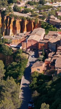 Aerial view of Roussillon and its ochre cliffs, a popular tourist destination in Luberon