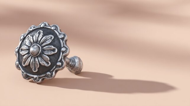 Decorative antique metal knob with floral design against transparent background