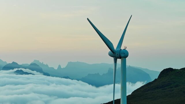 Wind turbine close-up in cloud inversion conditions, Madeira. Energy transition and decarbonization of power generation