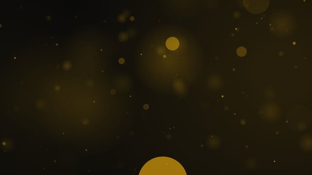 Gold dust particles with floating bokeh spheres drifting slowly on black background for cinematic award show and elegant event video backgrounds.