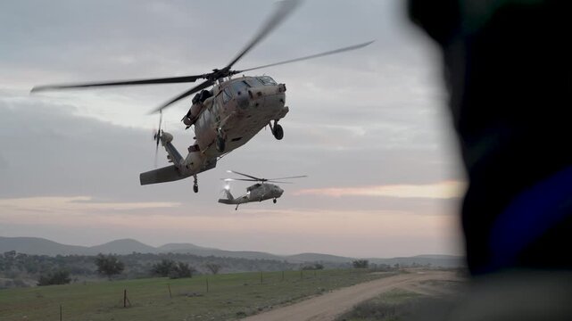 Cinematic slow motion view of a military helicopter 