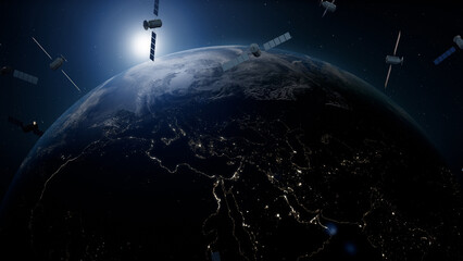 Satellites orbiting Earth at night with city lights visible on surface © Piotr Adamczyk