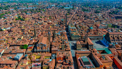 Aerial drone view of Bologna historic center with Asinelli and Garisenda Two Towers, Via Rizzoli, Piazza Maggiore and San Petronio Basilica, Emilia-Romagna, Italy, summer © Photo London UK
