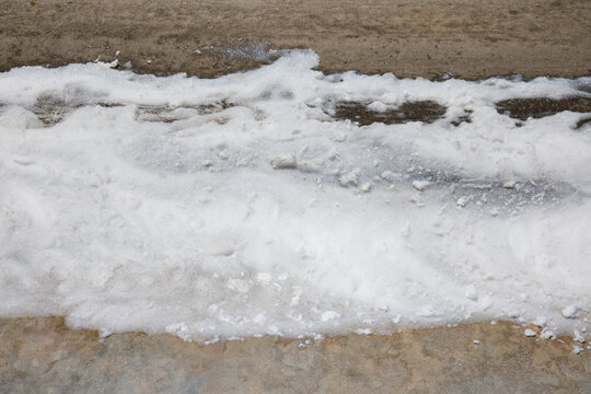 PFAS Firefighting Foam Contamination on Street Polluting Soil with Forever Chemicals Background