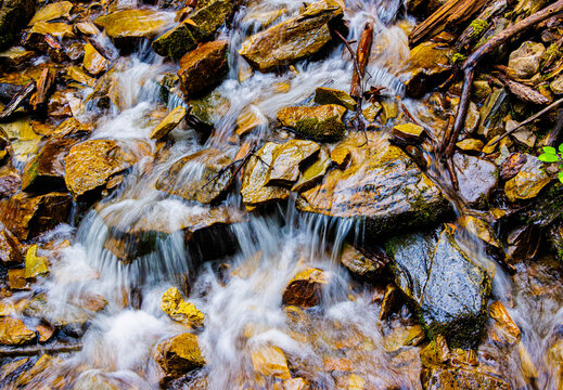 Mingo Creek Cascading Over Small Boulders and Logs at The Bottom of Mingo Falls, Great Smoky Mountains National Park, North Carolina, USA