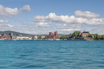 Fototapeta premium Oslo City Hall landmark towers and Akershus fortress. Skyline of Oslo, Norway