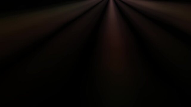 Soft rays of light emerging from darkness creating a dramatic atmosphere