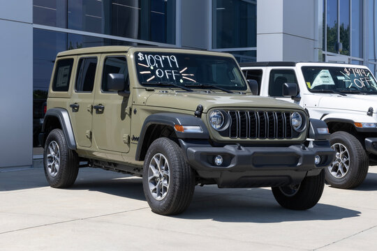 Jeep Wrangler 4-Door Sport 4X4 at a dealership. Jeep offers the Wrangler with a 2.0L 4-Cylinder Turbo engine. MY:2025