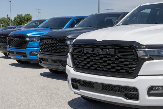 Ram 1500 pickup trucks at a dealership. Ram offers the 1500 with a Hurricane I6, 5.7L HEMI V8 or a 3.6L V6 engine. MY:2026