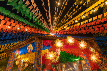Fototapeta premium Traditional Brazilian Festa Junina Decoration with Colorful Paper Lanterns and Bunting Flags