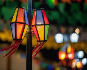 Fototapeta premium Traditional Brazilian Festa Junina Decoration with Colorful Paper Lanterns and Bunting Flags