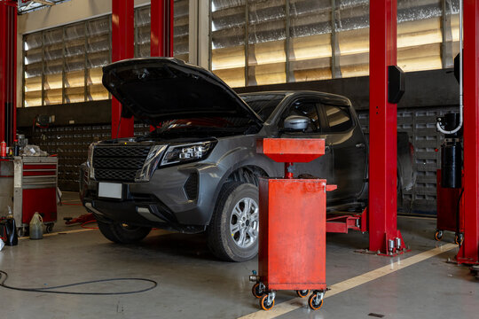 Vehicles Under Maintenance in Professional Auto Repair Service Center