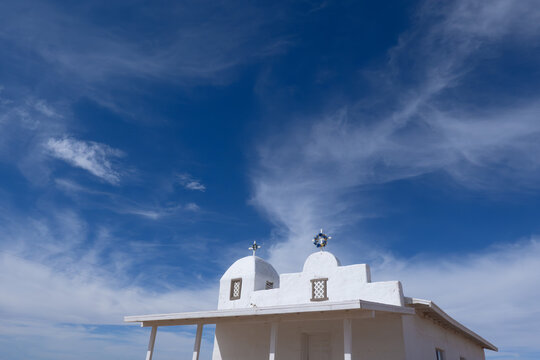 White Mission Church Roof Against Dramatic Desert Sky
