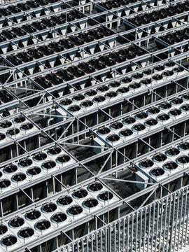 Aerial view of the industrial cooling fans on the roof of a data center facility in Riga, Latvia.