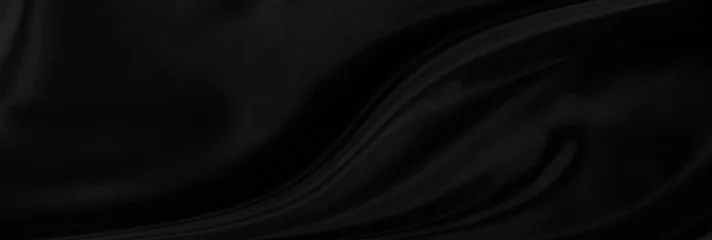 Black gray satin dark fabric texture luxurious shiny that is abstract silk cloth panorama background with patterns soft waves blur beautiful. © Kamjana