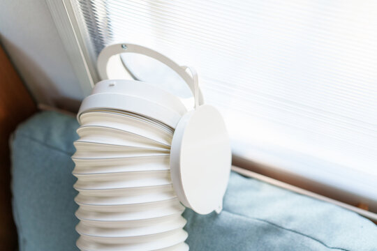 Installing a portable air conditioner exhaust hose into a custom polycarbonate window kit