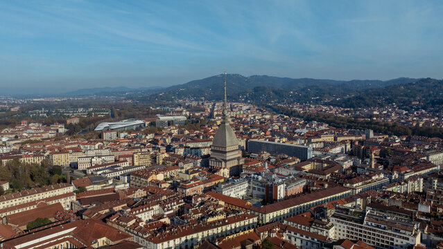 Aerial view of the Mole Antonelliana rising above the historic rooftops and urban landscape of Torino, Piemonte, Italy.