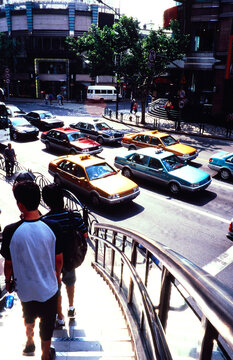 Busy Street Scene With Cars and Pedestrians in Beijing 