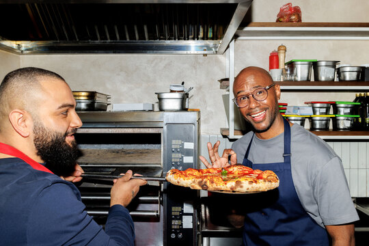 Chefs with pizza