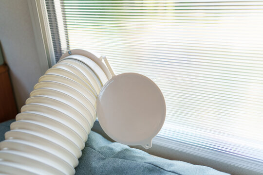 Installing a portable air conditioner exhaust hose into a custom polycarbonate window kit