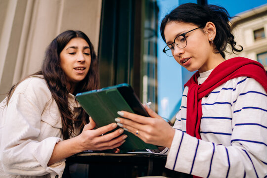 A women using a tablet in the city