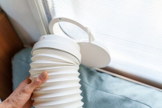 Installing a portable air conditioner exhaust hose into a custom polycarbonate window kit