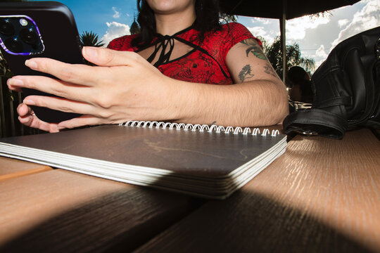 Woman Using Smartphone in Low-Angle Flash Portrait