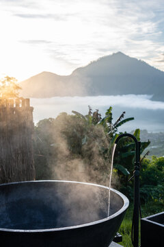 Steaming Outdoor Bathtub Overlooking Mount Batur at Sunrise