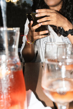 Flash-Lit Sangria Glasses With Smartphone in Background