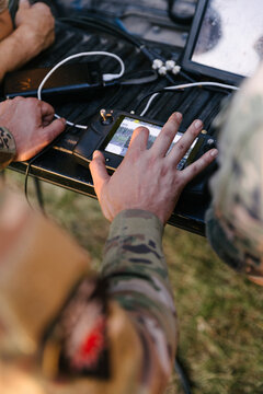 Ukrainian military operating drone controller on battlefield