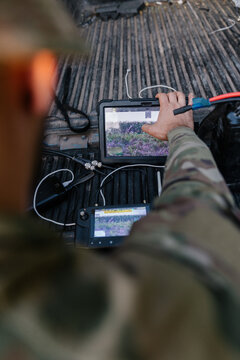 Ukrainian soldier operating  drone controller. Ukrainian heavy strike drone-bomber (hexacopter) UAV