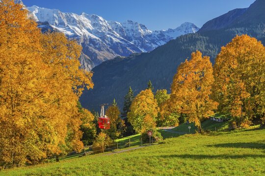 Autumn landscape with cable car to the hamlet of Sulwald, Isenfluh, Lauterbrunnental, Bernese Oberland, Canton of Bern, Switzerland