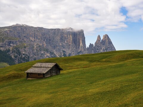 Alpine hut in front of the Sciliar, Punta Santner, Dolomites, Alpe di Siusi, South Tyrol, Italy