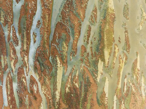 Abstract patterns at low tide in the marshland of the Walvis Bay lagoon. Aerial view. Drone shot. Walvis Bay, Namibia