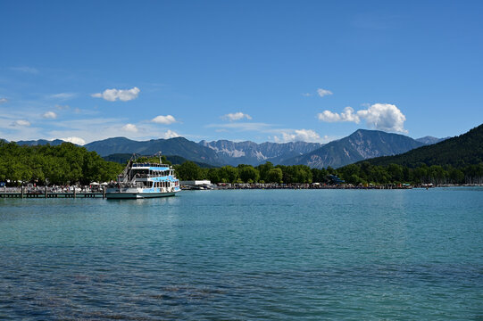 View of Lake Worthersee, Austria on calm summer day.