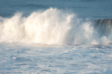 Fototapeta premium Massive Double Breaking Wave with Towering White Foam Wall on Tropical Coast, Indonesia