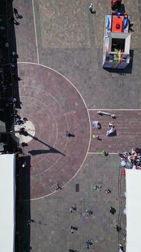 Aerial drone view of an overhead view of the plaza with a parade contingent during the Feria de San Marcos in Aguascalientes, Mexico.