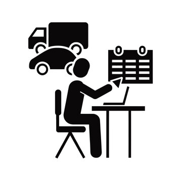 Logistics manager sits at a desk while reviewing a shipping schedule and fleet vehicle tracking.